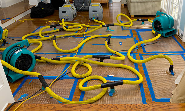 Professional Flood Damage Restoration technician working in North Benton, OH